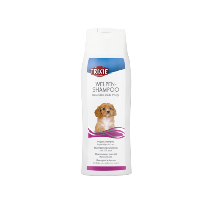 Schampoflaska som har en brun/vit lite hundvalp på sig